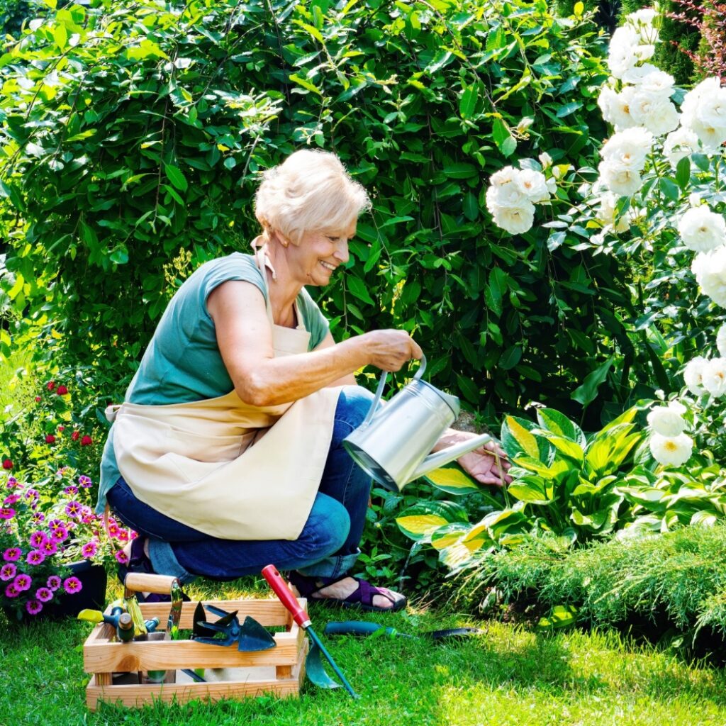 A woman tending to a garden.