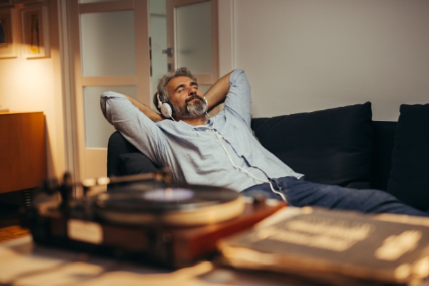 A man relaxing while listening to music.