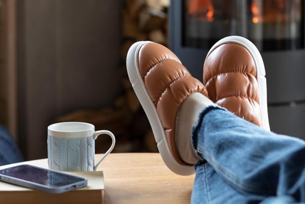A person sitting with their feet up.
