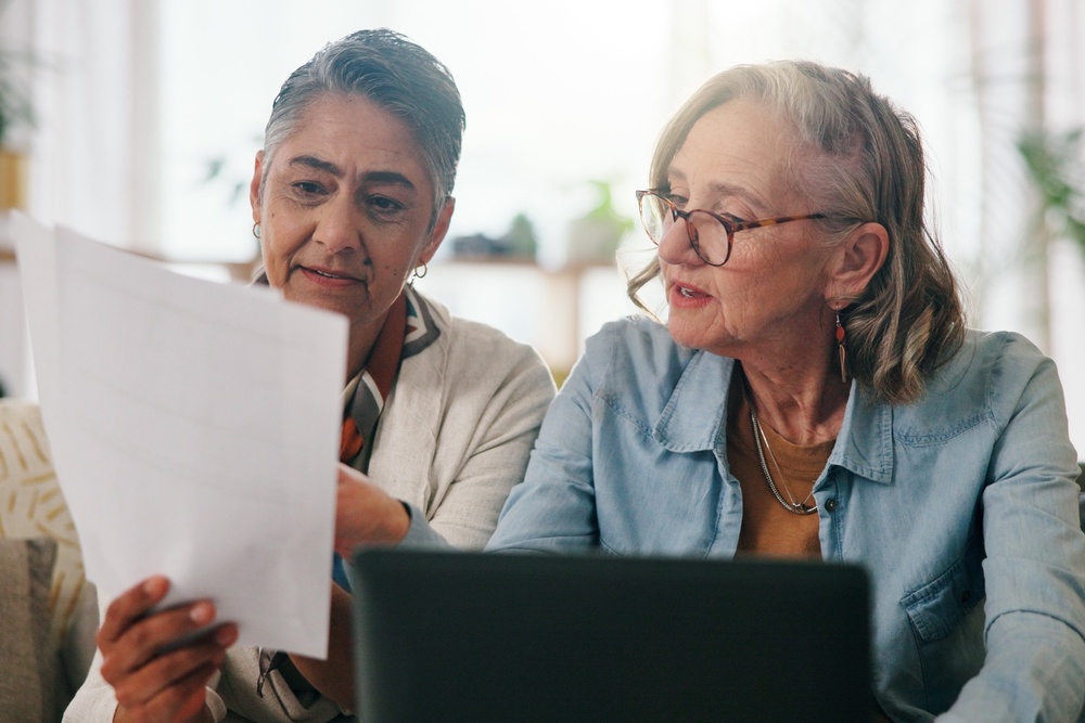 A couple reviewing paperwork together.